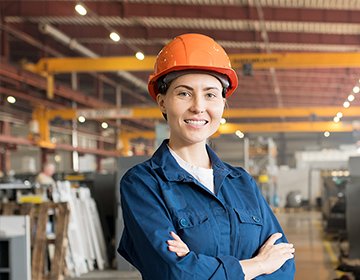 female employee standing in production area